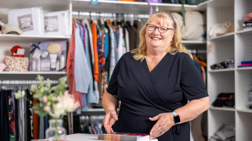 Women smiling in a store | Housing Plus